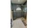 Beautiful bathroom shower with stylish tiles and a frameless glass door at 2399 Bendway Dr, Port Charlotte, FL 33948