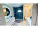 Modern bathroom with white double vanity and a glass enclosed tile shower at 2399 Bendway Dr, Port Charlotte, FL 33948