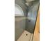 Shower features modern fixtures, rain shower head, and stylish blue tiling at 2399 Bendway Dr, Port Charlotte, FL 33948