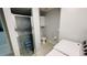Clean bathroom with a shower, toilet, and washer and dryer at 2399 Bendway Dr, Port Charlotte, FL 33948
