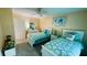 Bedroom features two beds with matching comforters and décor and neutral-toned walls at 2399 Bendway Dr, Port Charlotte, FL 33948
