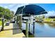 View of boat on lift with covered top at 2399 Bendway Dr, Port Charlotte, FL 33948