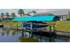 View of boat on lift with covered top at 2399 Bendway Dr, Port Charlotte, FL 33948
