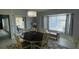 Dining area with a view of the outdoor space, comfortable seating, and stylish decor at 2399 Bendway Dr, Port Charlotte, FL 33948
