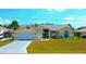 Charming single-story home with well-manicured lawn and driveway at 2399 Bendway Dr, Port Charlotte, FL 33948