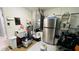 Garage sink area with a refrigerator and water heater at 2399 Bendway Dr, Port Charlotte, FL 33948
