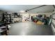 A well-lit garage featuring storage shelves and work area at 2399 Bendway Dr, Port Charlotte, FL 33948