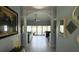 Welcoming foyer with soaring ceilings, decorative columns, and scenic backyard views at 2399 Bendway Dr, Port Charlotte, FL 33948