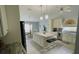 Modern kitchen with an island, stainless appliances, pendant lighting, and breakfast bar seating at 2399 Bendway Dr, Port Charlotte, FL 33948