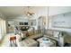 Inviting living room featuring a large sectional sofa, decorative accents, and a cozy atmosphere at 2399 Bendway Dr, Port Charlotte, FL 33948