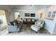 Bright living room with ample seating, soft decor, and an open-concept design at 2399 Bendway Dr, Port Charlotte, FL 33948