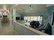 Open concept living room with high ceilings, large windows, and sliding glass doors to backyard at 2399 Bendway Dr, Port Charlotte, FL 33948