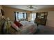 Main bedroom featuring a bay window and an adjacent seating area with pool view at 2399 Bendway Dr, Port Charlotte, FL 33948