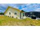 View of side of house with a screened-in pool at 2399 Bendway Dr, Port Charlotte, FL 33948