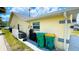 Side of house showing window and trash bins at 2399 Bendway Dr, Port Charlotte, FL 33948