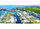 Aerial view of waterfront neighborhood highlighting the property's prime location and water access at 24239 Yacht Club Blvd, Punta Gorda, FL 33955