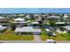 Waterfront home with a metal roof, canal access, and RV/boat parking on a grassy lot, located in a waterfront community at 24239 Yacht Club Blvd, Punta Gorda, FL 33955