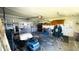 Functional garage space with a golf cart, cabinets, and ample room for storage at 24239 Yacht Club Blvd, Punta Gorda, FL 33955
