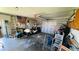 Spacious garage with a golf cart, storage shelves, and a ladder at 24239 Yacht Club Blvd, Punta Gorda, FL 33955