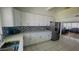 Bright kitchen featuring white cabinetry, stainless steel appliances, and tile backsplash at 24239 Yacht Club Blvd, Punta Gorda, FL 33955