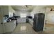 Spacious kitchen features stainless appliances, a tile floor, and white cabinets and drawers at 24239 Yacht Club Blvd, Punta Gorda, FL 33955