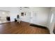 Cozy room featuring laminate floors, double doors, and neutral walls at 24239 Yacht Club Blvd, Punta Gorda, FL 33955