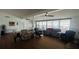 Open living room with hardwood floors, ceiling fans, and waterfront views at 24239 Yacht Club Blvd, Punta Gorda, FL 33955