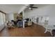 Open floor plan with stone fireplace, hardwood floors, and ample seating at 24239 Yacht Club Blvd, Punta Gorda, FL 33955