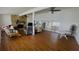 Spacious living room with wood flooring, stone fireplace, and natural light at 24239 Yacht Club Blvd, Punta Gorda, FL 33955