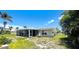 Tranquil setting with a screened lanai for relaxing and enjoying views of the lush backyard at 24239 Yacht Club Blvd, Punta Gorda, FL 33955