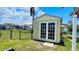 Charming shed with double doors, perfect for storage or a hobby space at 24239 Yacht Club Blvd, Punta Gorda, FL 33955