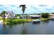 Waterfront home with direct canal access, boat dock, and a screened lanai, perfect for enjoying waterfront living at 24239 Yacht Club Blvd, Punta Gorda, FL 33955