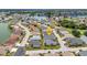 A high angle shot shows the home located on a cul-de-sac in a beautifully planned community at 24358 Folkstone Ave, Punta Gorda, FL 33980