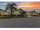 Charming home with a well-manicured lawn, tropical landscaping, and inviting curb appeal at 24358 Folkstone Ave, Punta Gorda, FL 33980