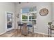 Eat-in kitchen table with bright natural light and a view to the lanai at 24358 Folkstone Ave, Punta Gorda, FL 33980