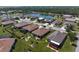 Aerial view of a home in a community, near a pond at 25008 Lalique Pl, Punta Gorda, FL 33950
