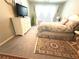 Comfortable bedroom highlighting a beautifully patterned rug, a dresser, and plush carpeting at 25008 Lalique Pl, Punta Gorda, FL 33950