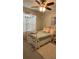 Charming bedroom with a white bed frame, soft bedding, and natural light at 25008 Lalique Pl, Punta Gorda, FL 33950
