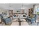 Bright community room with ample seating, tables, and bookshelves; perfect for gatherings at 25008 Lalique Pl, Punta Gorda, FL 33950
