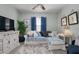 Relaxing living space with a comfortable sofa, accent pillows, and a TV for cozy entertainment at 25008 Lalique Pl, Punta Gorda, FL 33950