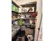 Spacious walk-in pantry featuring ample shelving for storage and organization at 25008 Lalique Pl, Punta Gorda, FL 33950