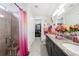 Stylish bathroom boasts a double vanity, granite countertops, and a seamless glass shower at 2515 Sherman Oak Dr, North Port, FL 34289