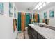 Bright bathroom features a granite vanity with decorative hand towels and vanity decor at 2515 Sherman Oak Dr, North Port, FL 34289
