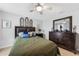 Cozy bedroom with neutral tones features a plush bed and classic furnishings at 2515 Sherman Oak Dr, North Port, FL 34289