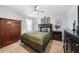 Cozy bedroom with neutral tones features a plush bed and classic furnishings at 2515 Sherman Oak Dr, North Port, FL 34289