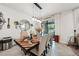 Elegant dining area with stylish lighting, seating for six, and access to the screened-in patio at 2515 Sherman Oak Dr, North Port, FL 34289