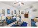 Comfortable living room with tile flooring, stylish decor, and an inviting seating arrangement at 2515 Sherman Oak Dr, North Port, FL 34289