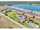 Aerial view of waterfront condo community featuring manicured grounds, community pool, and dedicated parking at 25275 Rampart Blvd # 1504, Punta Gorda, FL 33983