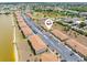 Scenic aerial view of condo complex with lake access and well maintained landscaping at 25275 Rampart Blvd # 1504, Punta Gorda, FL 33983
