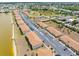 Scenic aerial view of condo complex with lake access and well maintained landscaping at 25275 Rampart Blvd # 1504, Punta Gorda, FL 33983